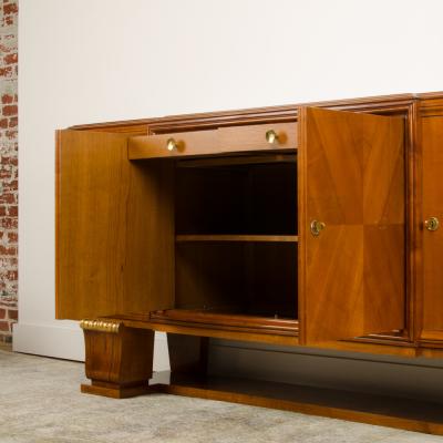 A fine French 1940s walnut veneer with gilded carved wood details sideboard