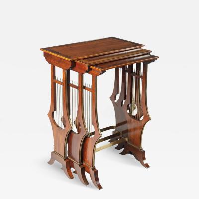 A fine and unusual nest of three Regency tables