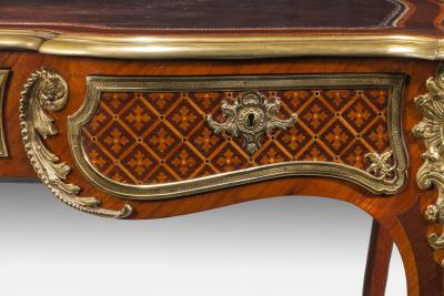 A fine kingwood and marquetry bureau plat in the French taste
