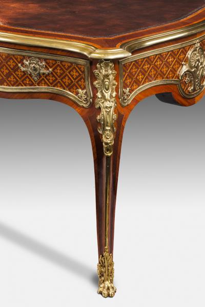 A fine kingwood and marquetry bureau plat in the French taste