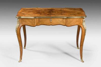A fine mid Victorian burr walnut writing table