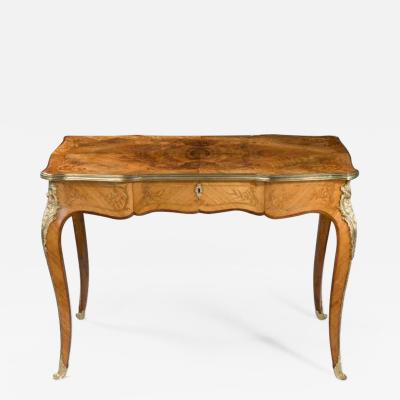 A fine mid Victorian burr walnut writing table