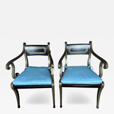 A fine pair of caned Regency ebonized and gilt chairs
