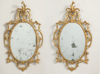 A fine pair of rococo looking glasses