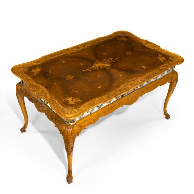 A fine walnut and burr walnut Orientalist centre table