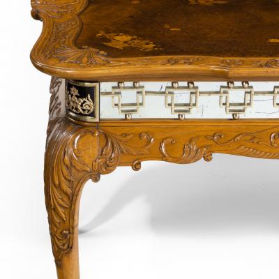 A fine walnut and burr walnut Orientalist centre table
