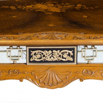 A fine walnut and burr walnut Orientalist centre table