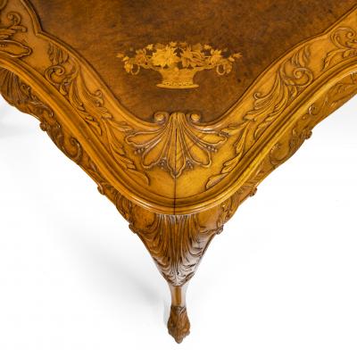 A fine walnut and burr walnut Orientalist centre table