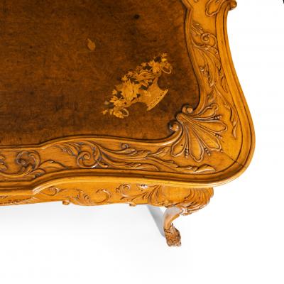 A fine walnut and burr walnut Orientalist centre table