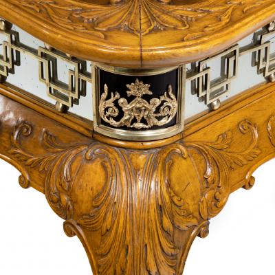 A fine walnut and burr walnut Orientalist centre table