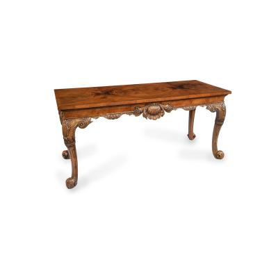 A finely carved walnut side table in the George II style