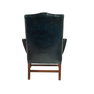 A generous George III wing arm chair