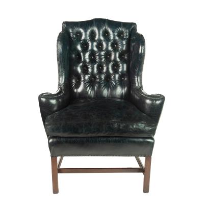 A generous George III wing arm chair