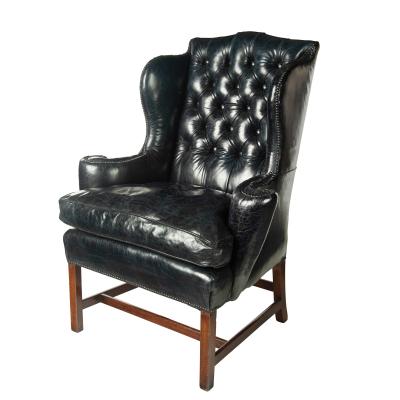 A generous George III wing arm chair
