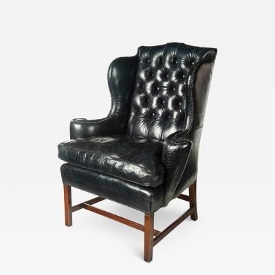 A generous George III wing arm chair