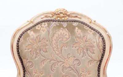 A gilt and painted French upholstered open armchair in the Louis XV style 