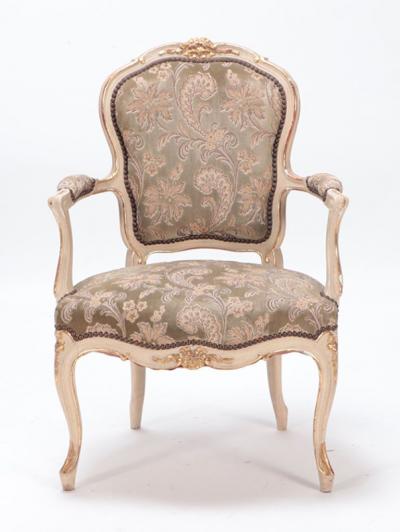 A gilt and painted French upholstered open armchair in the Louis XV style 