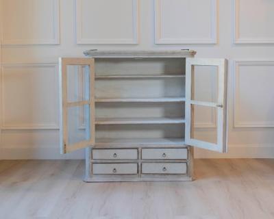 A hanging cabinet from Sweden with glass doors in grey