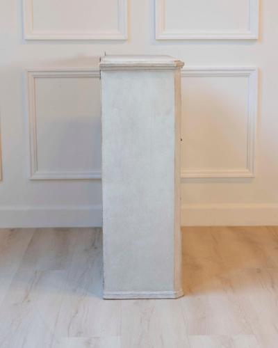 A hanging cabinet from Sweden with glass doors in grey