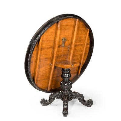 A large Anglo Ceylonese ebony and specimen wood centre table circa 1840