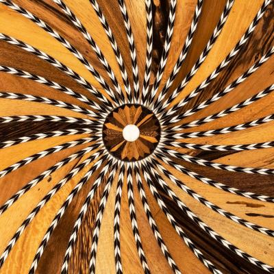 A large Anglo Ceylonese ebony and specimen wood centre table circa 1840