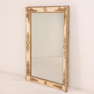 A large French Empire wood and gesso mirror C 1840