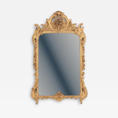 A large French Louis XV style carved giltwood mirror 18th C 