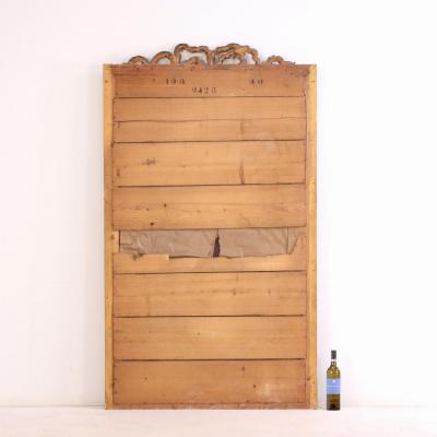 A large French Neoclassical Revival giltwood mirror with ribbon crest C 1890 