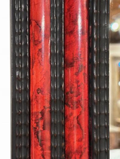 A large French ripple carved and faux tortoiseshell cushion mirror 