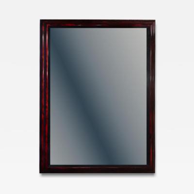 A large French ripple carved and faux tortoiseshell cushion mirror 