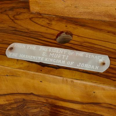 A large Holy Land mother of pearl abalone shell and olive wood icon