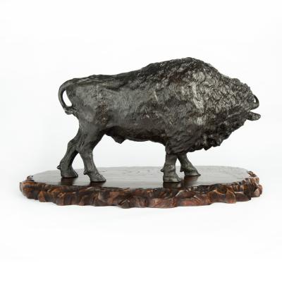 A large Meiji period bronze bison by Sano Takachika for the Kakuha Company