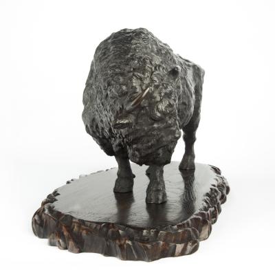 A large Meiji period bronze bison by Sano Takachika for the Kakuha Company