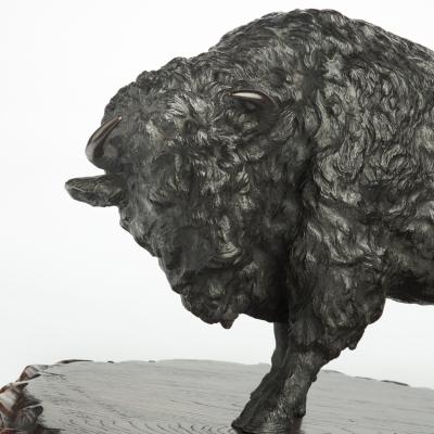 A large Meiji period bronze bison by Sano Takachika for the Kakuha Company