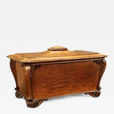 A large William IV fiddleback mahogany cellaret