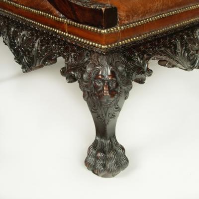 A large pair of Irish mahogany library armchairs in the Georgian style