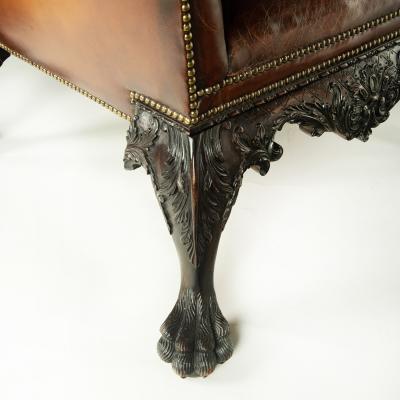 A large pair of Irish mahogany library armchairs in the Georgian style