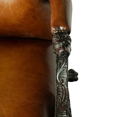 A large pair of Irish mahogany library armchairs in the Georgian style