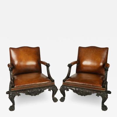 A large pair of Irish mahogany library armchairs in the Georgian style