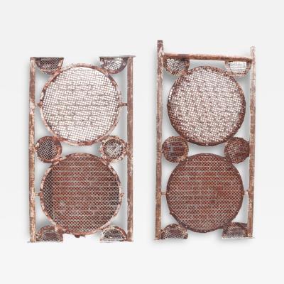 A large pair of iron panels with circle motif C 1940 