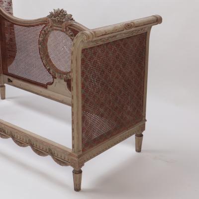 A late 19th Century French Directoire painted cane Daybed settee C 1880
