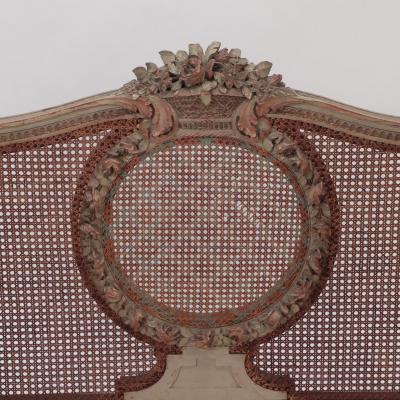 A late 19th Century French Directoire painted cane Daybed settee C 1880