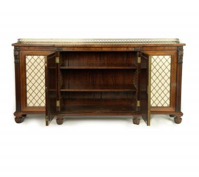 A late Regency rosewood breakfront four door side cabinet attributed to Gillows