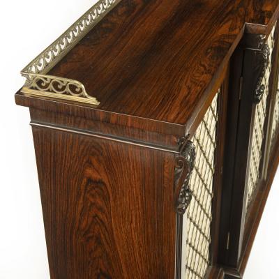 A late Regency rosewood breakfront four door side cabinet attributed to Gillows