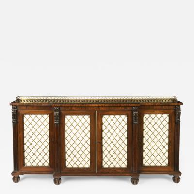 A late Regency rosewood breakfront four door side cabinet attributed to Gillows