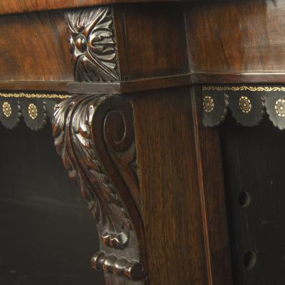 A late Regency rosewood breakfront open bookcase attributed to Gillows
