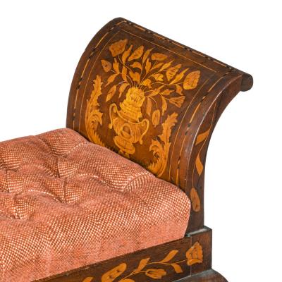 A late Regency rosewood window seat in the manner of George Oakley