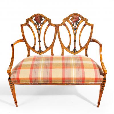 A late Victorian Sheraton revival painted satinwood two seater settee