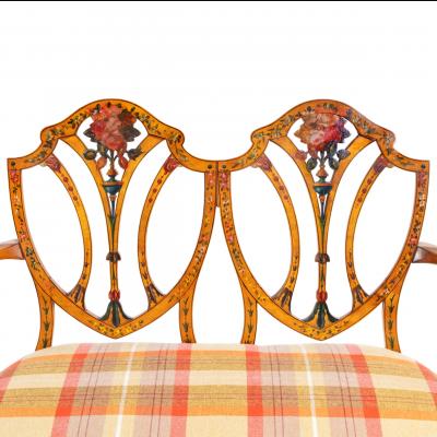 A late Victorian Sheraton revival painted satinwood two seater settee