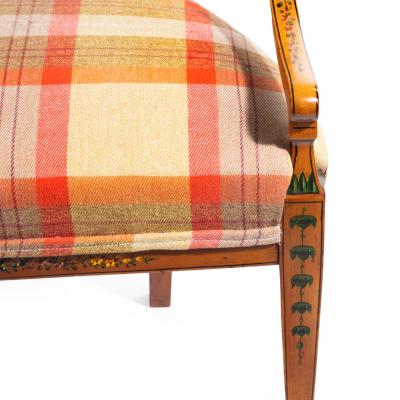 A late Victorian Sheraton revival painted satinwood two seater settee